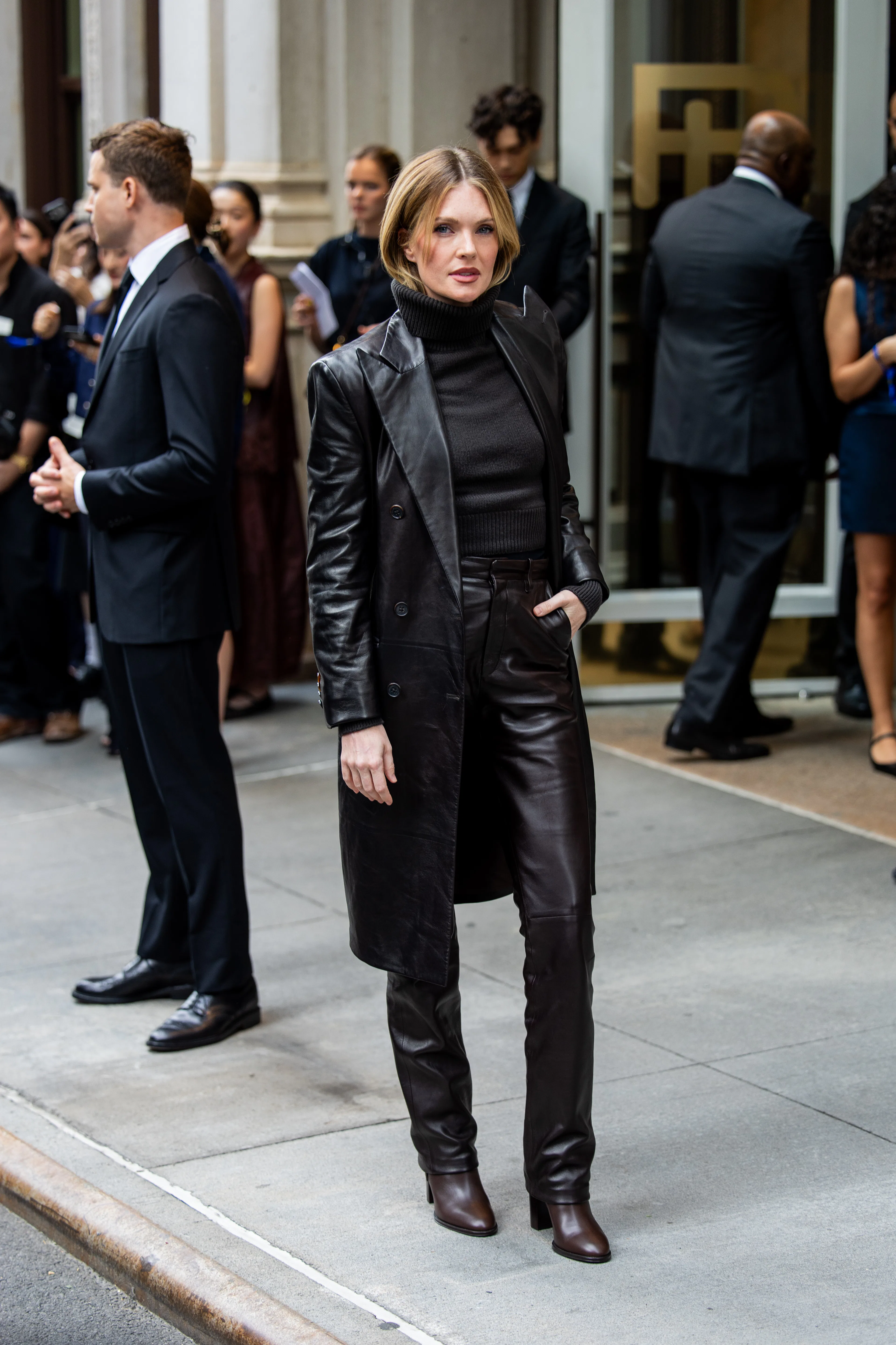 NEW YORK, NEW YORK - SEPTEMBER 09: Meghann Fahy wears black leather coat, pants, turtleneck outside ...