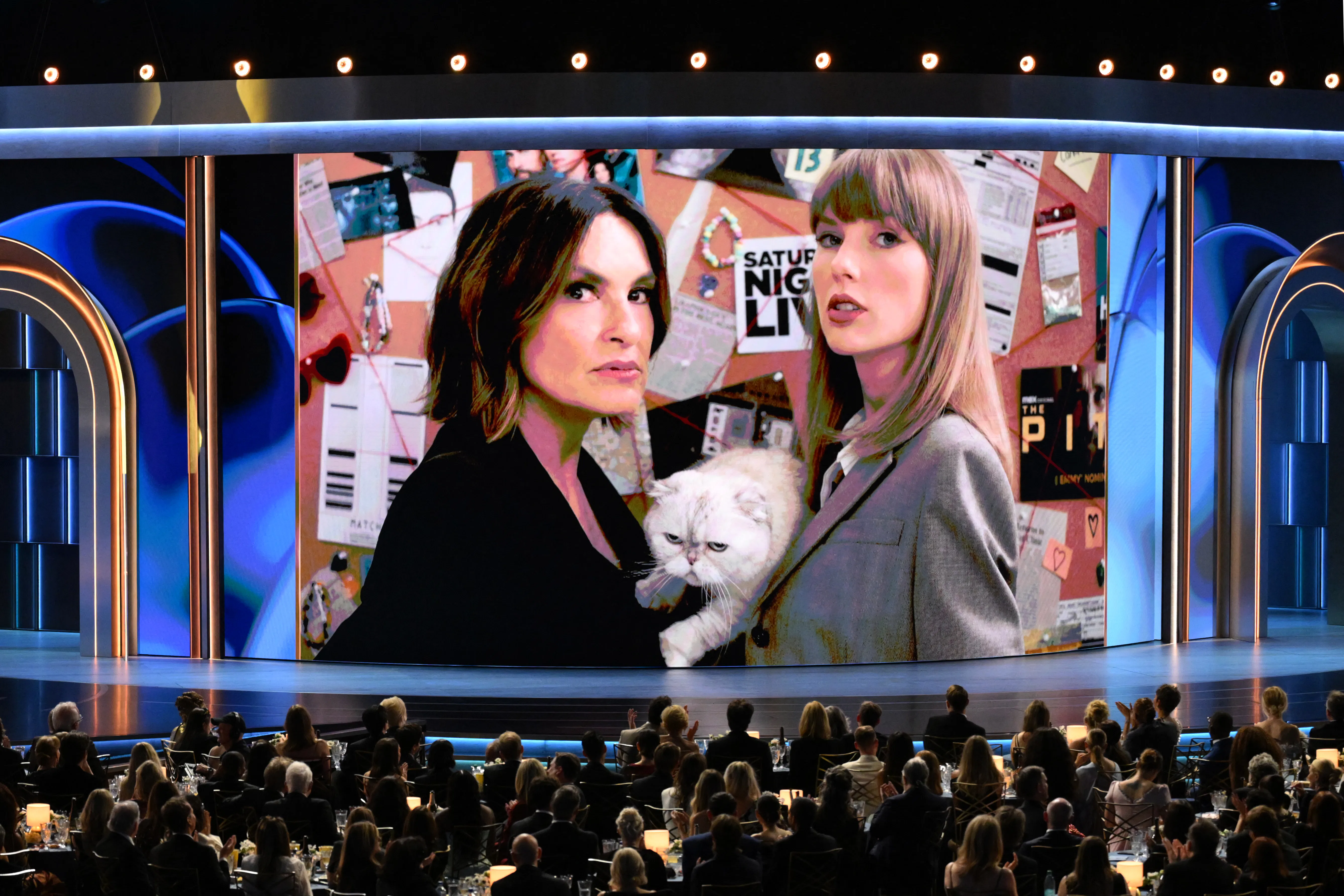 US director Mariska Hargitay and US singer Taylor Swift and her cat Olivia Benson appear on screen d...