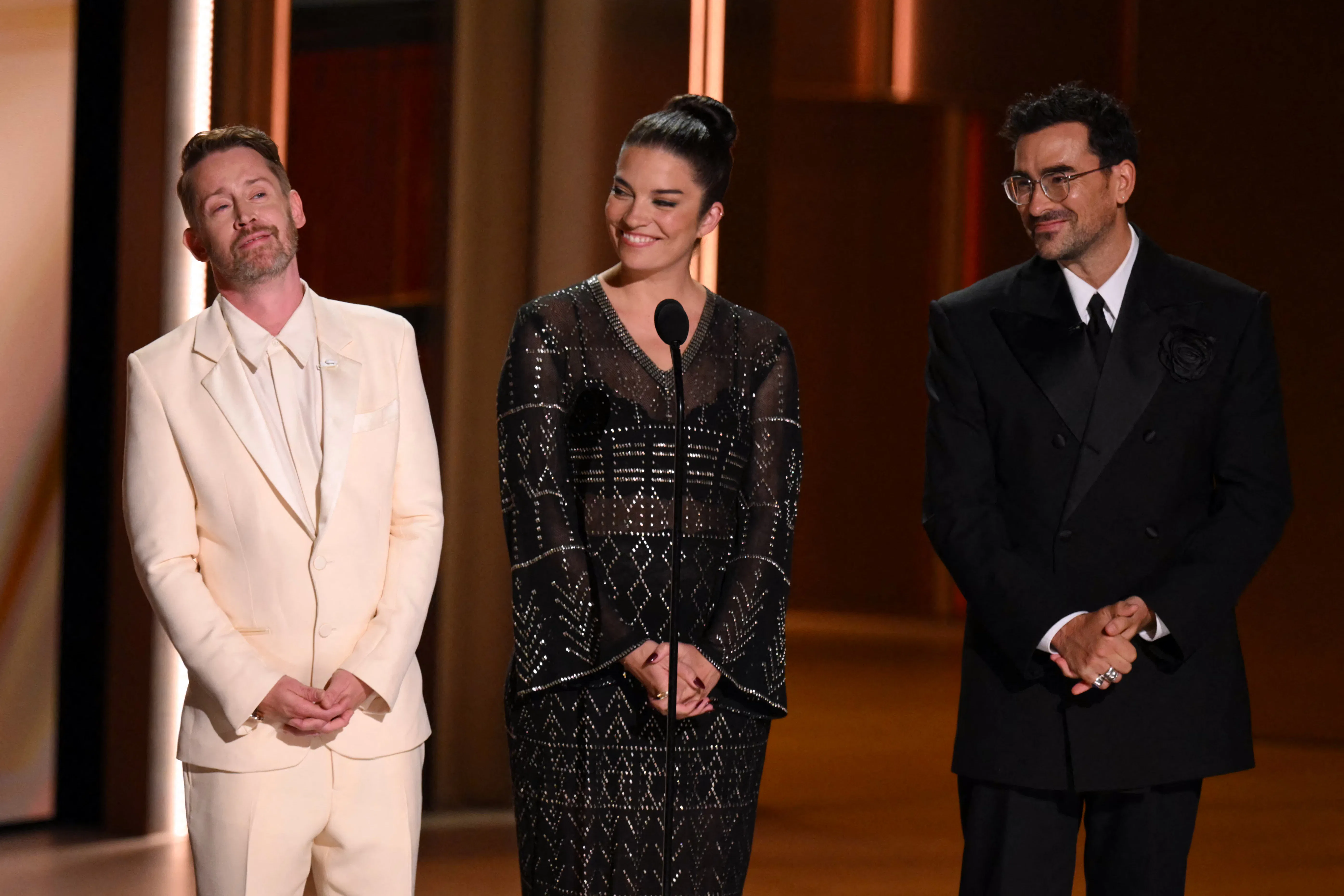 Macaulay Culkin, Annie Murphy and Dan Levy speak onstage during an homage to Catherine O'Hara at the...