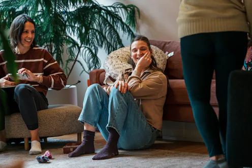 A group of women who are attending a postpartum support group which offers new parents lactation adv...