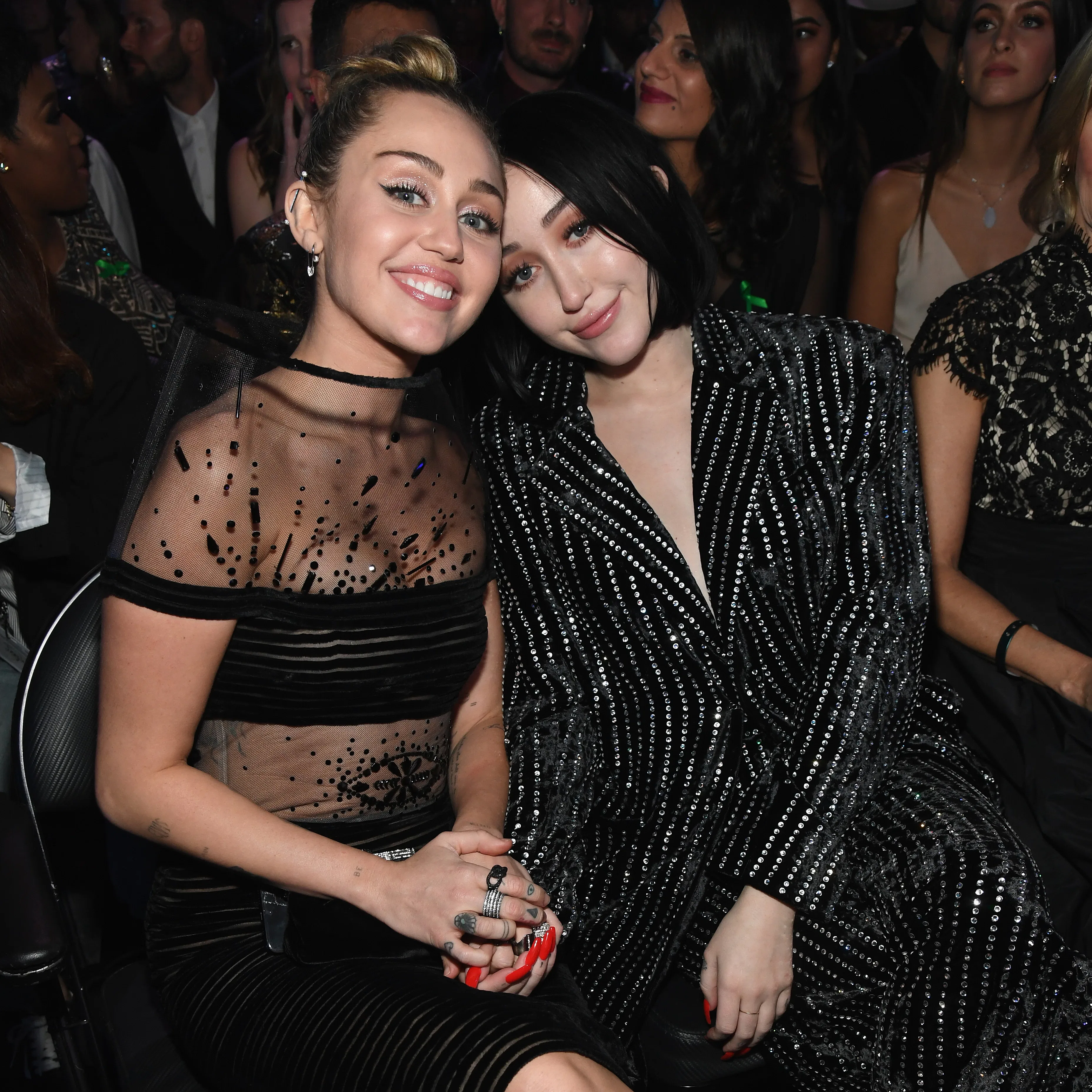 LOS ANGELES, CA - FEBRUARY 10:  Miley Cyrus (L) and Noah Cyrus pose during the 61st Annual GRAMMY Aw...