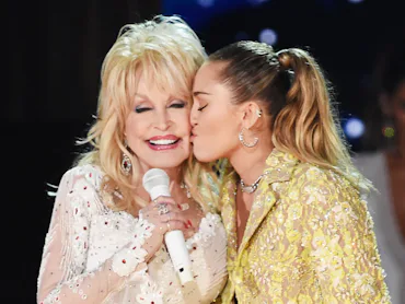 LOS ANGELES, CA - FEBRUARY 10: Dolly Parton (L) and Miley Cyrus perform onstage during the 61st Ann...