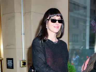 Dakota Johnson seen at the 'Verity' press junket wearing "vampy merlot" clothes.