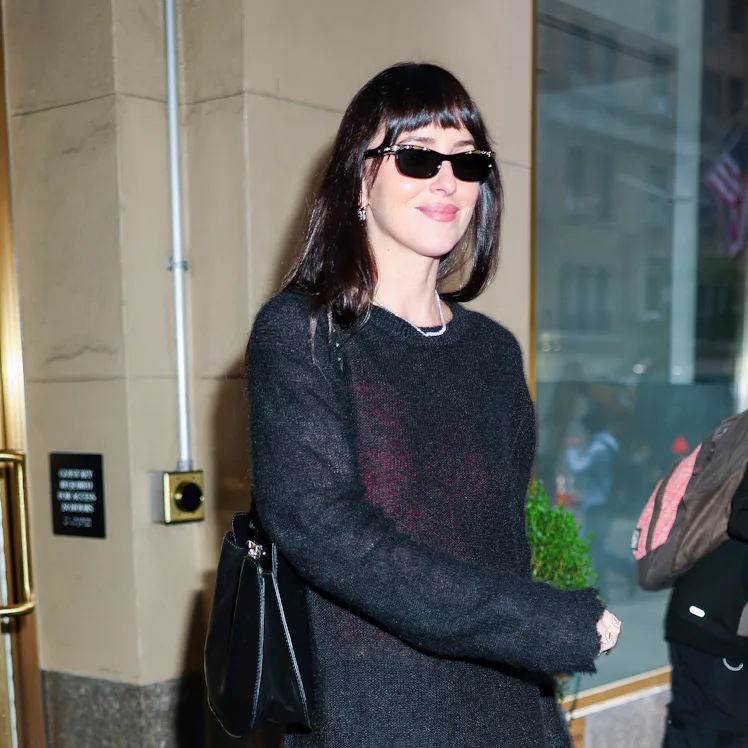 Dakota Johnson seen at the 'Verity' press junket wearing "vampy merlot" clothes.