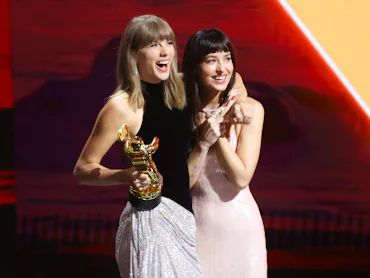 Taylor Swift and Dakota Johnson onstage as Swift accepts the Artist Director Honors at 2026 MTV Vide...