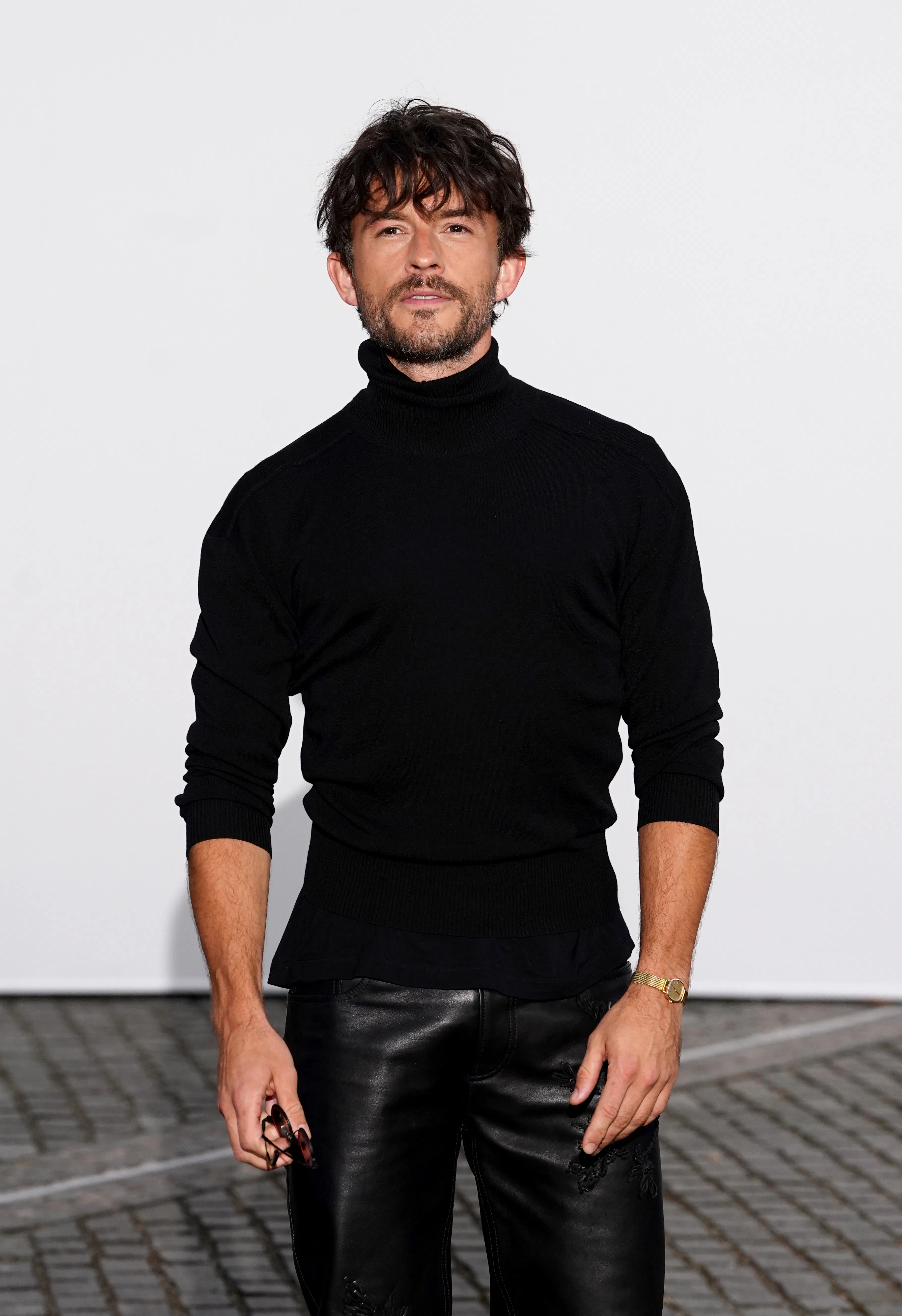 Jonathan Bailey attends the Burberry show at Chelsea College of Art, London, during London Fashion W...