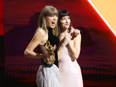 Taylor Swift and Dakota Johnson onstage as Swift accepts the Artist Director Honors at 2026 MTV Vide...