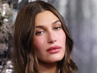 Hailey Bieber attends the "Wuthering Heights" Australian Premiere in a lacy black dress with pinky m...