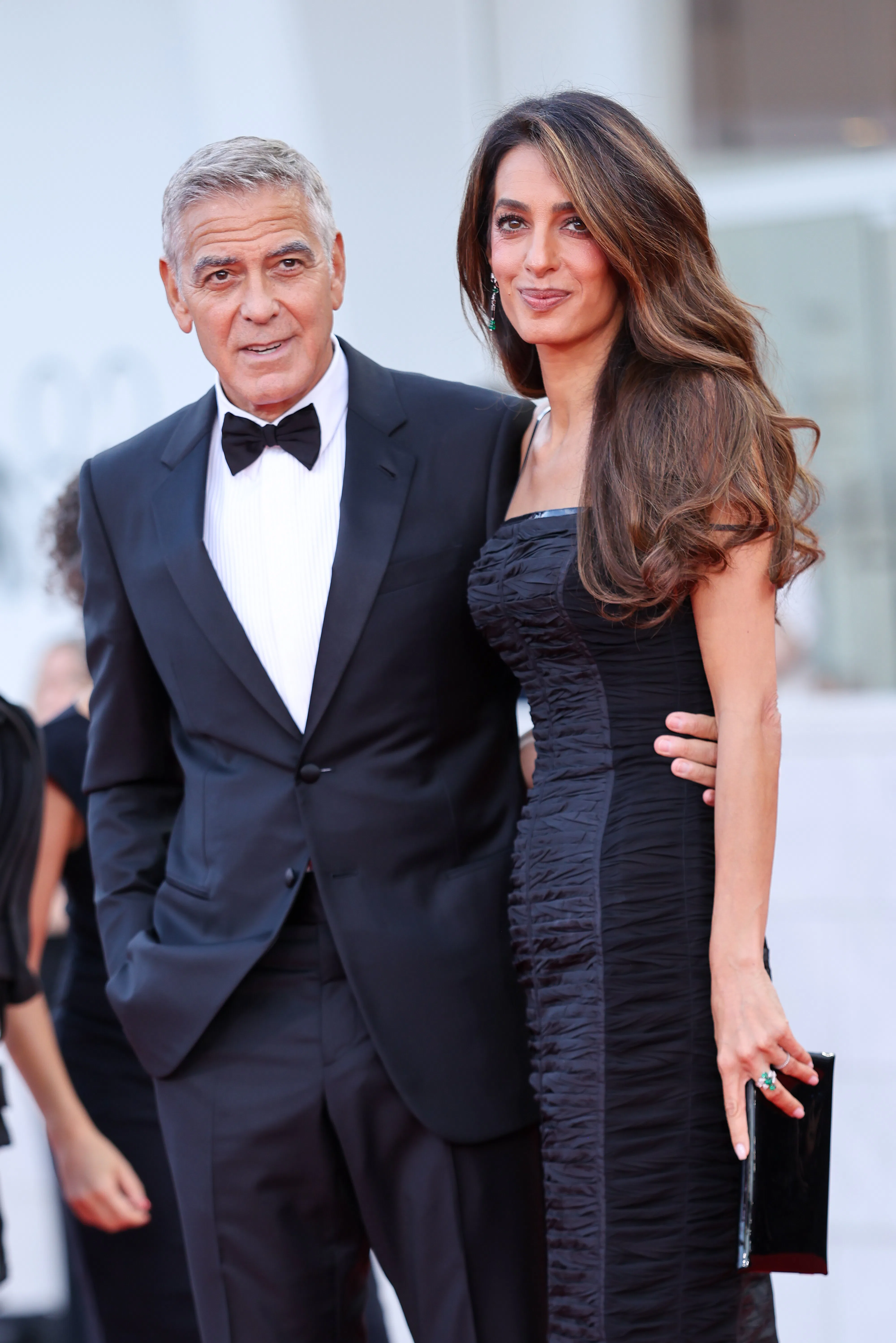 George Clooney and Amal Clooney at the Venice Film Festival, with the latter wearing "Blurred Brown"...