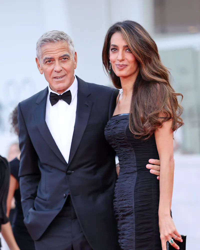 George Clooney and Amal Clooney at the Venice Film Festival, with the latter wearing "Blurred Brown"...