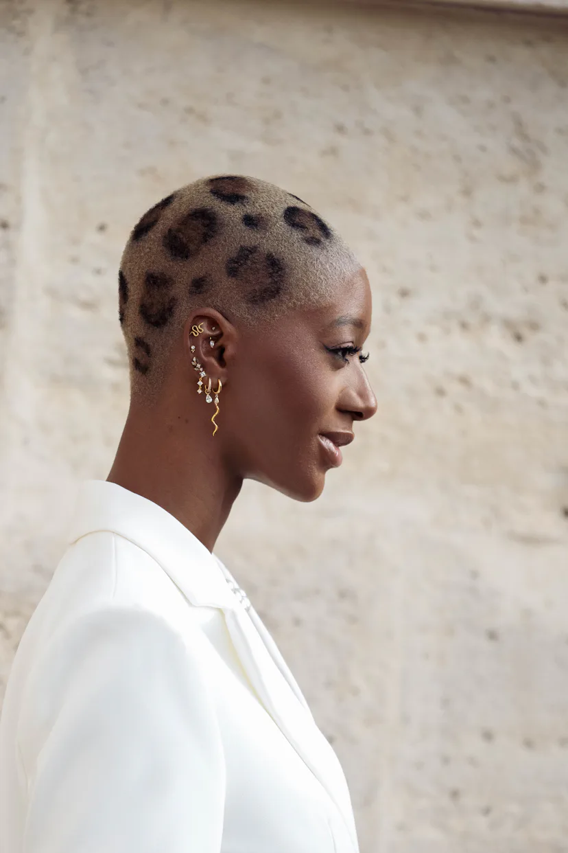 A guest with a cheetah-print buzzcut at paris fashion week spring/summer '27