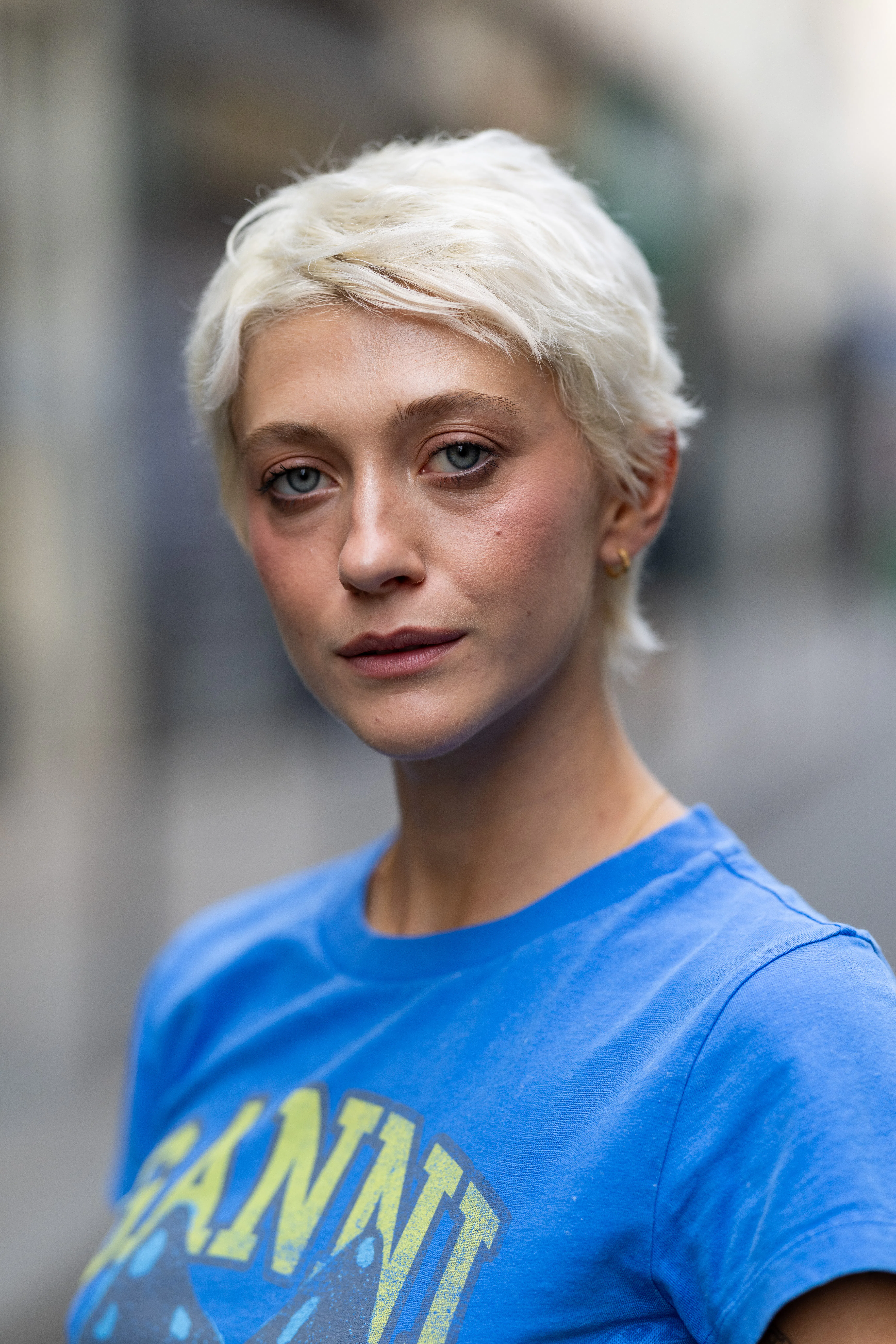 a guest with a short blonde pixie cut at paris fashion week s/s '27