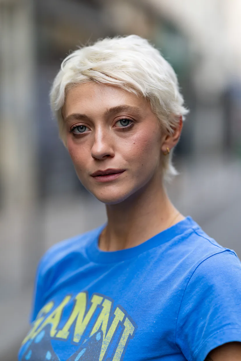 a guest with a short blonde pixie cut at paris fashion week s/s '27