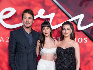 NEW YORK, NEW YORK - SEPTEMBER 29: (L-R) John Hartnett, Dakota Johnson and Anne Hathaway attend Amaz...