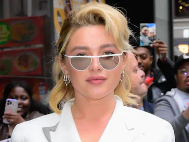 Florence Pugh in 2025 in a white suit with pinky-peach lipstick