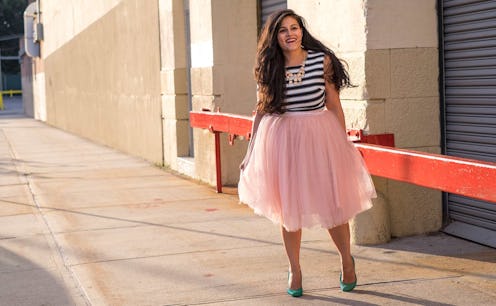 Nadia Boujarwah wearing a big tutu and a black and a white striped shirt