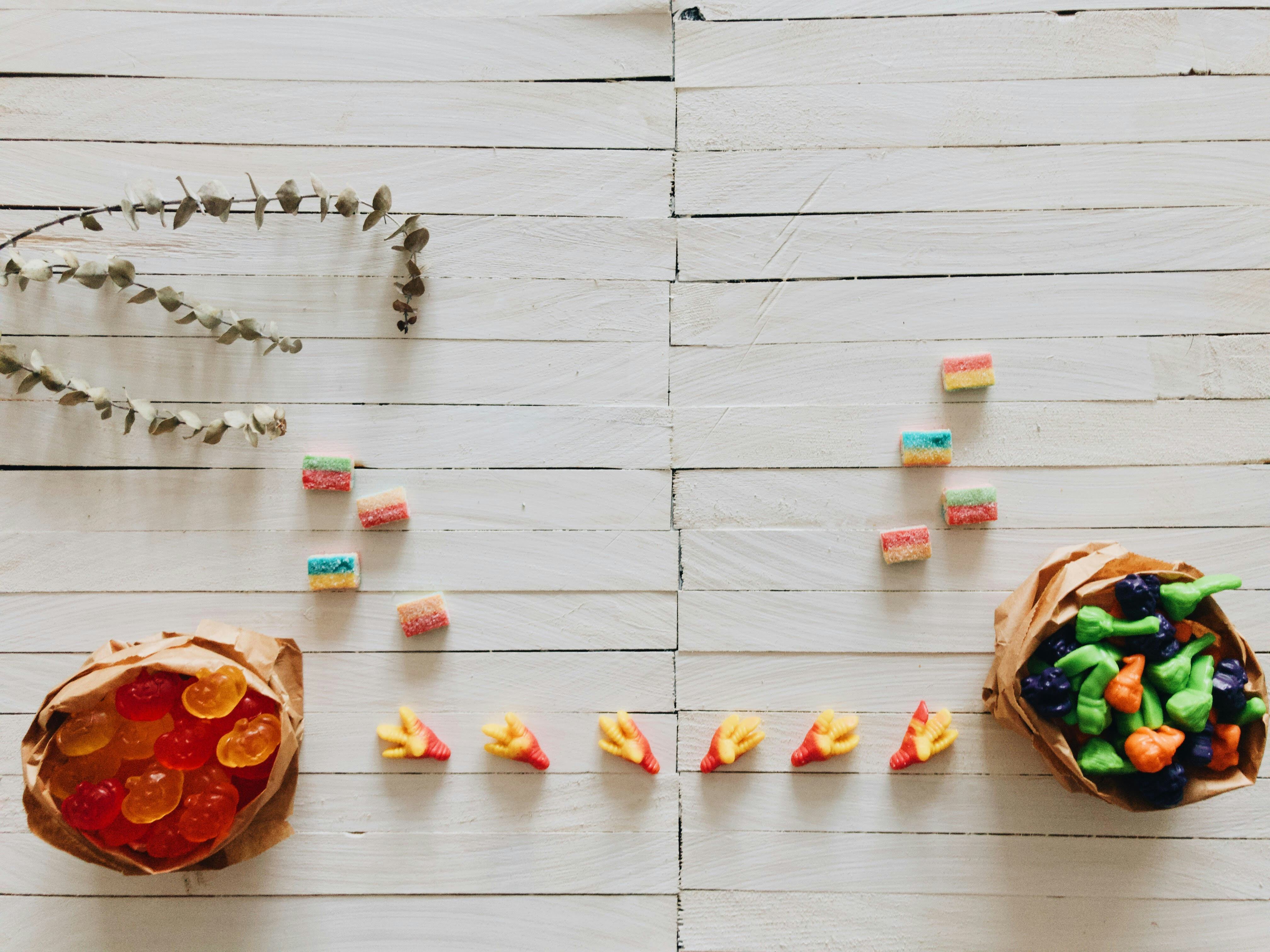 Paper bags filled with gummy candy collected during Halloween trick-or-treat.
