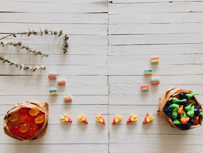 Paper bags filled with gummy candy collected during Halloween trick-or-treat.