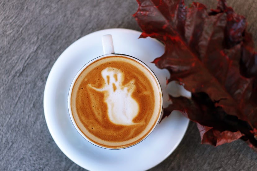 A macchiato coffee with a ghost image made with latter art