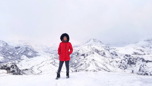 Melissa Lee, founder & CEO of the GREEN program, wearing a red winter jacket with a fur hoodie on a ...