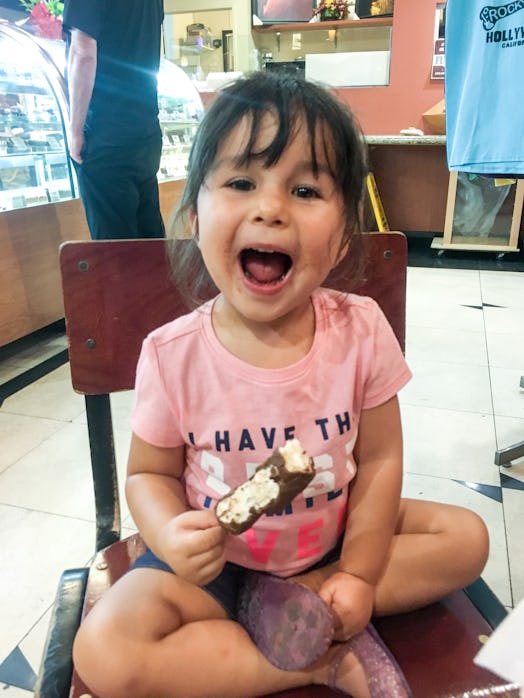 A little girl eating an ice cream