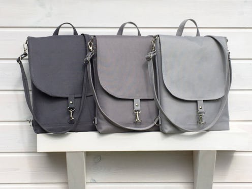 Three weatherproof laptop bags in three different shades of gray