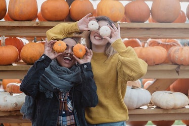Pumpkin puns for Instagram are great for these two friends holding mini pumpkins over there eyes in ...