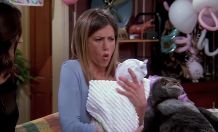 Rachel looking scared while holding a baby in the 'Friends.'
