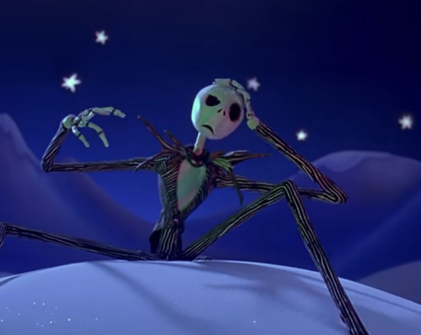 Jack Skellington looks puzzled as he sits on a snowbank in Christmas Town.