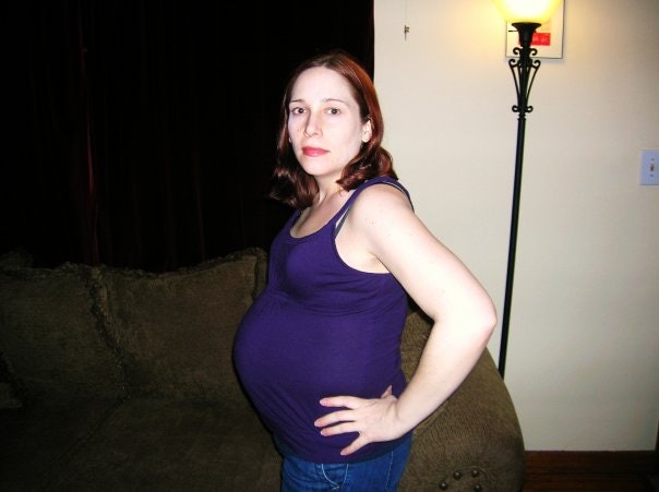 pregnant belly carrying high
