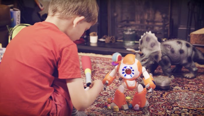 A little boy playing with smart toys