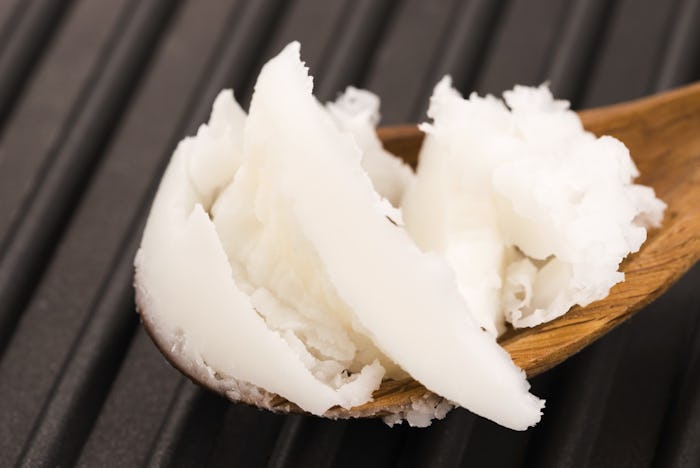 Coconut oil on a wooden spoon