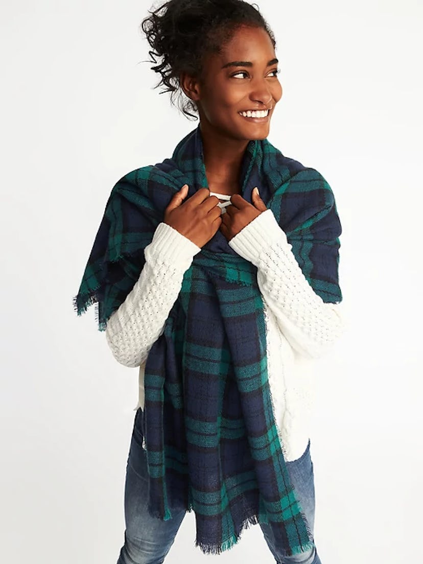 A model posing with flannel blanket scarf 