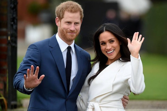 Prince Harry and his fiancé Meghan Markle waving