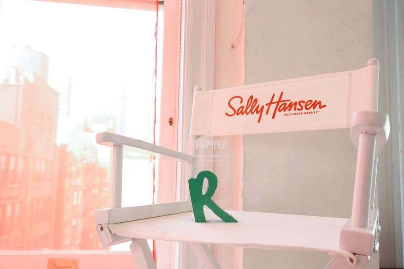 A white chair with the red text "Sally Hansen" over it