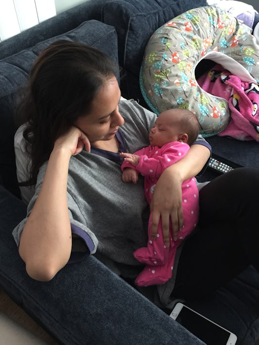 Yasmine Singhs' baby sleeping in her arms