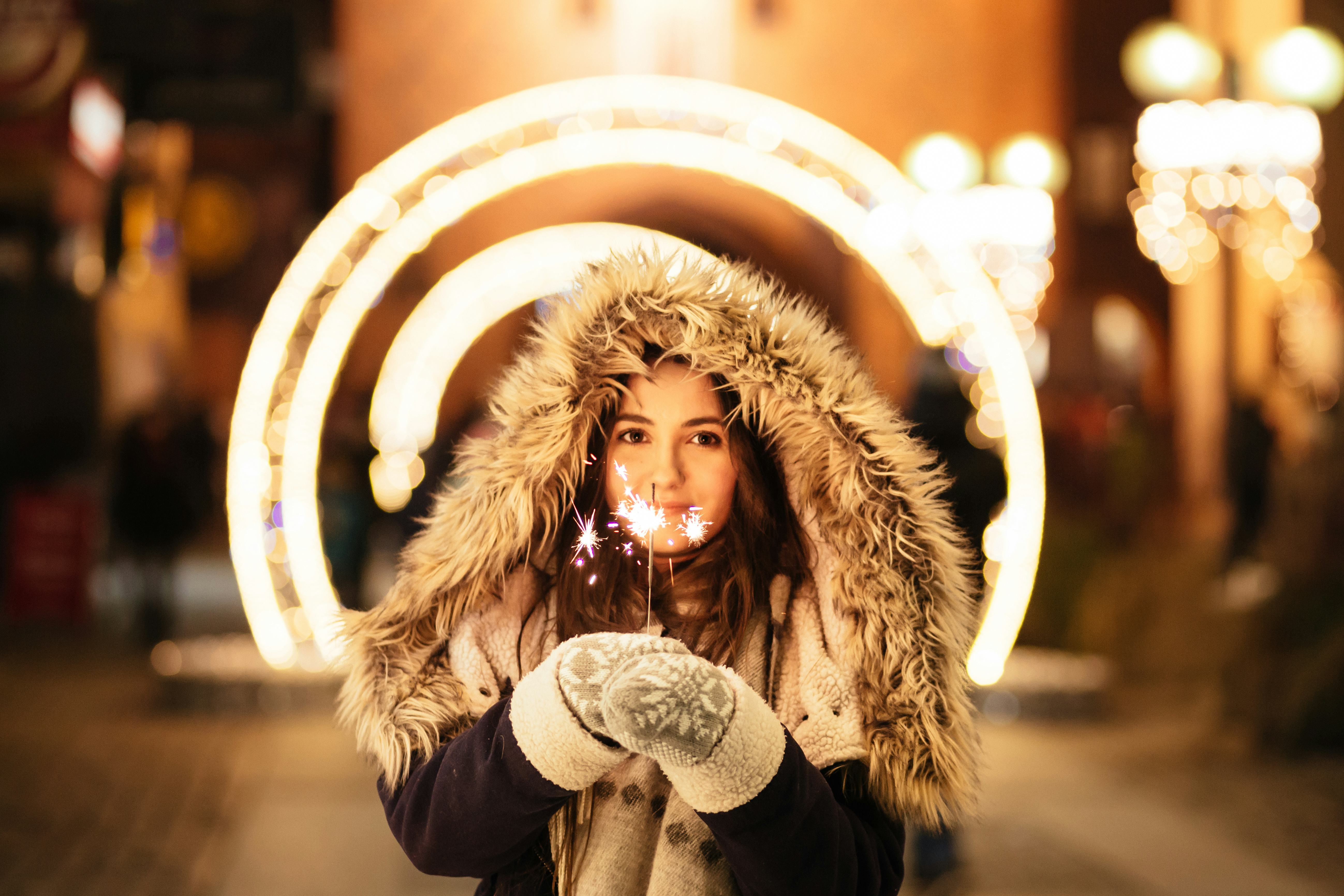 A woman holding a sprinkler on Christmas 