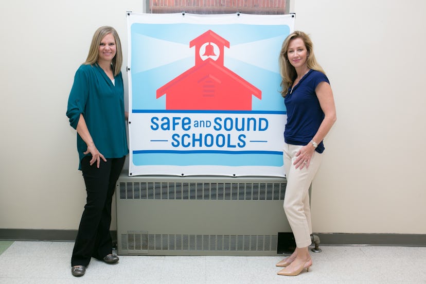 Michele Gay and Alissa Parker in front of a Safe and Sound Schools Banner.