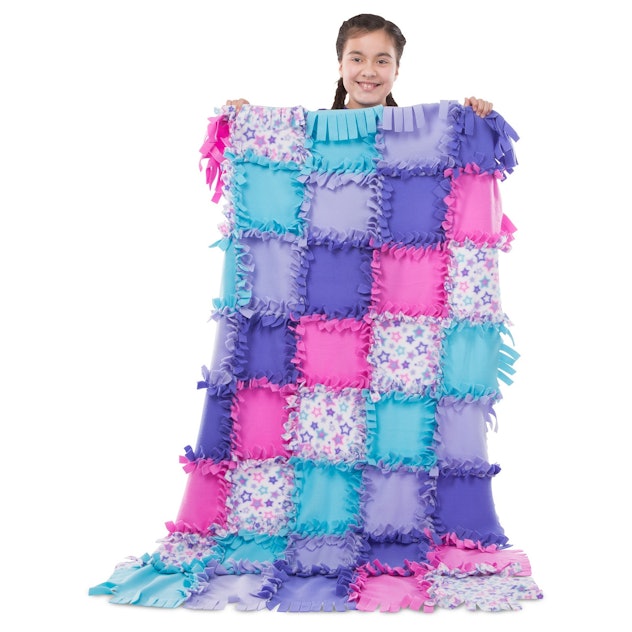 Fleece Quilt Kit held by a girl