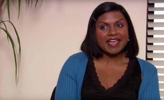 Mindy Kaling in a black shirt and blue sweater in 'The Office'