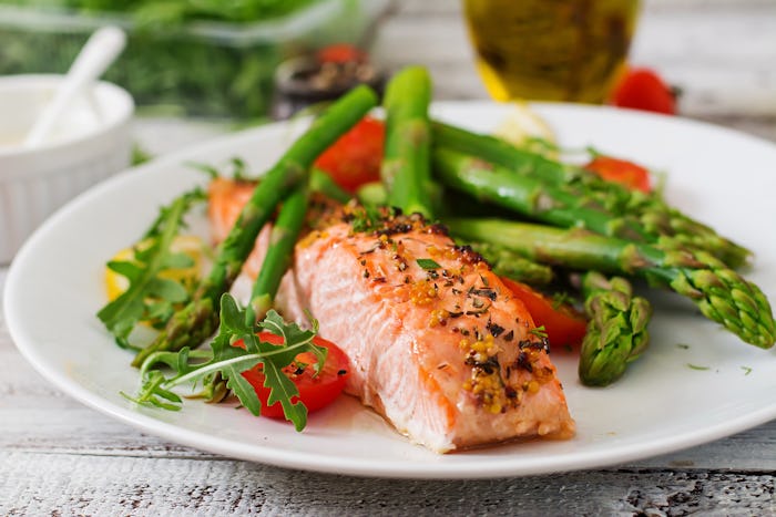 Fish served on a plate with green vegetables