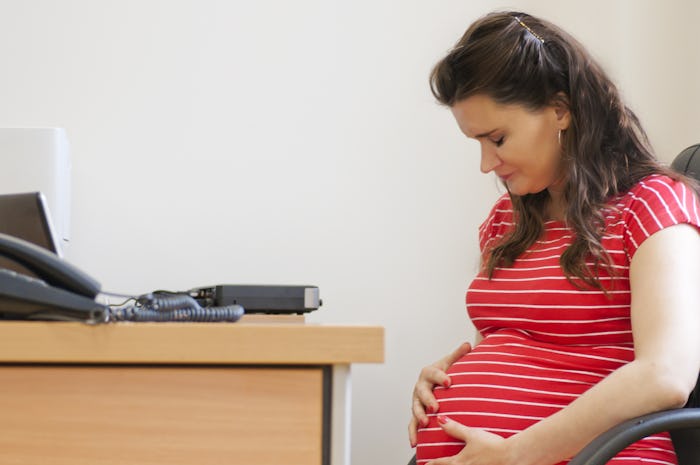 A pregnant woman in a red-white striped shirt who got into labor during a job interview