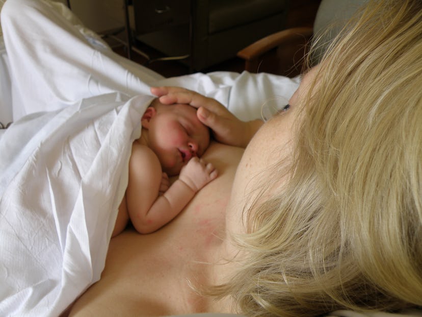 Newborn baby sleeping on mother's chest