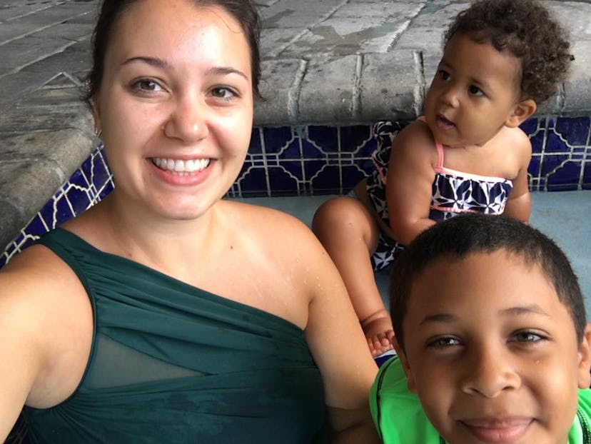 Mother with her two children taking a selfie at the pool