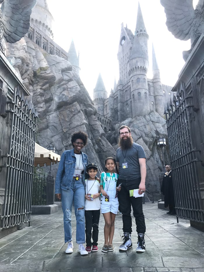Margaret E. Jacobsen, her now Ex-husband and their two kids in a Harry Potter theme park