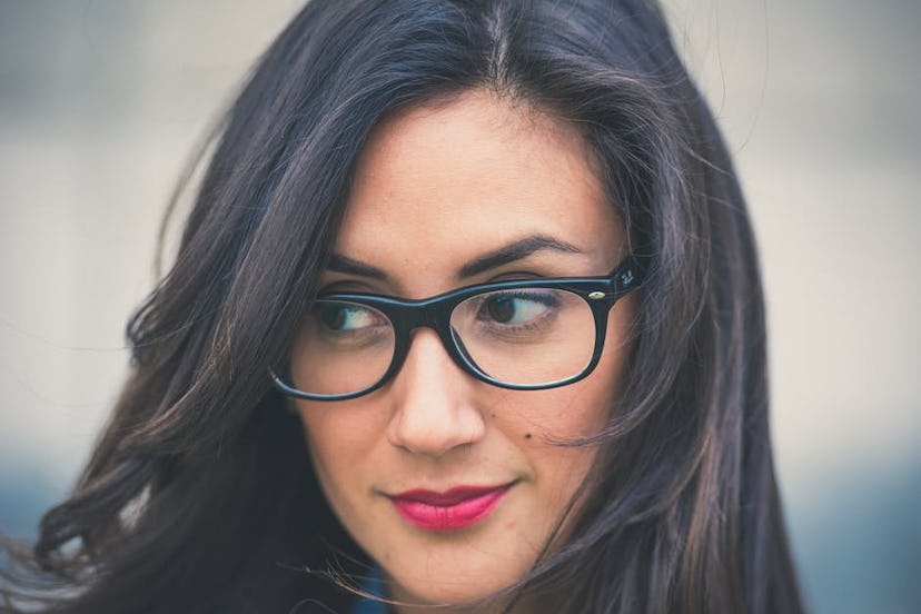 Beautiful looking black haired woman with glasses