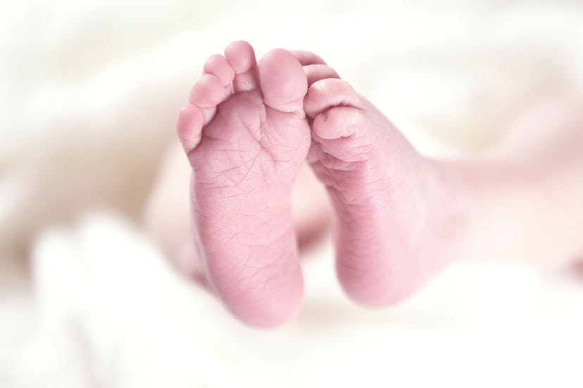 A closeup of the feet of a newborn who was born with defects due to mother's obesity during pregnanc...