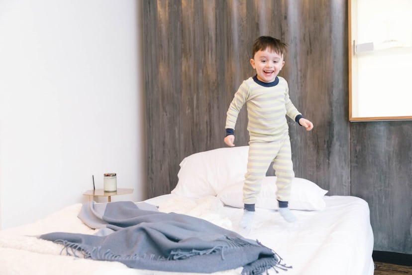 toddler going through a sleep regression, jumping on the bed 