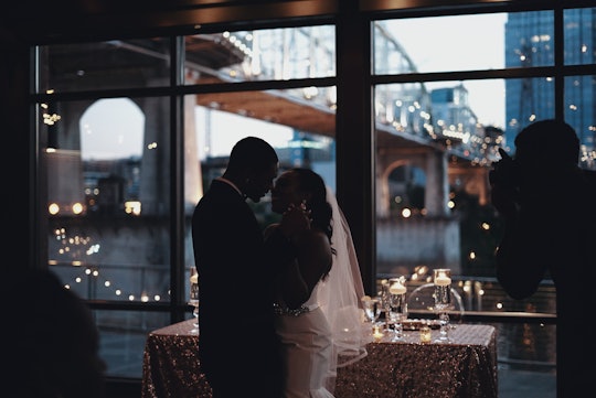 A woman and her SO on their wedding day during their first dance