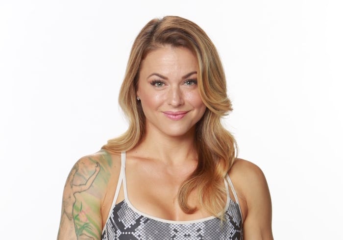 Tattooed Christmas Abbott posing for a photo